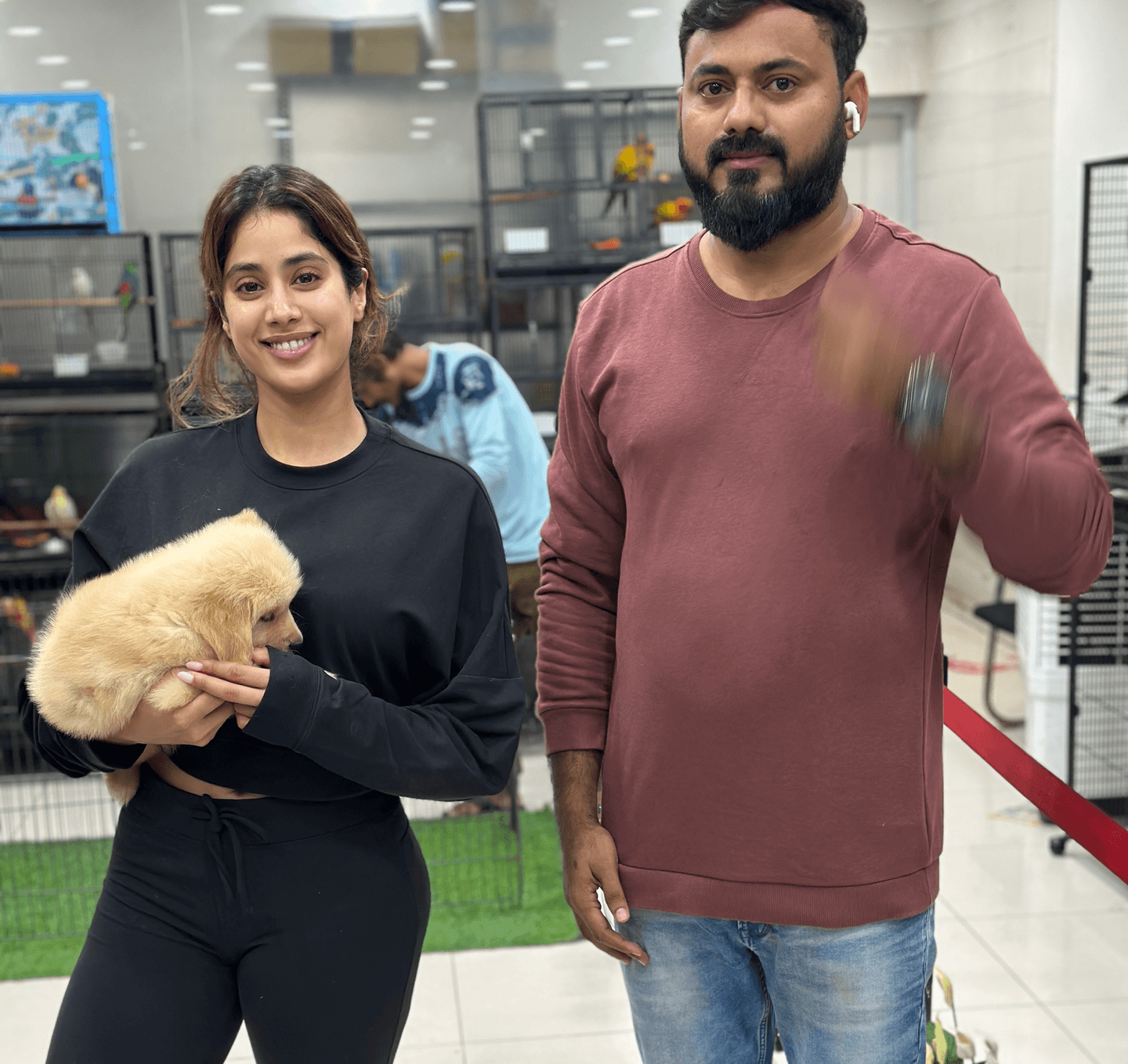 Celebrity with Golden Retriever puppy at Danny Pet Store